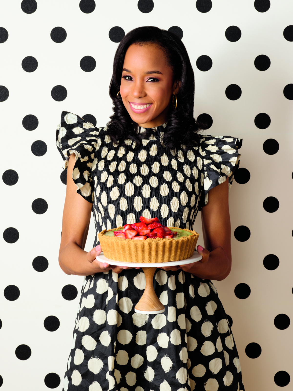 A woman holding a pie.