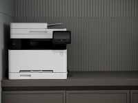 Copier/Printer sitting on top of counter in an office