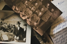 Old photographs in black and white and old handwritten letters spread out